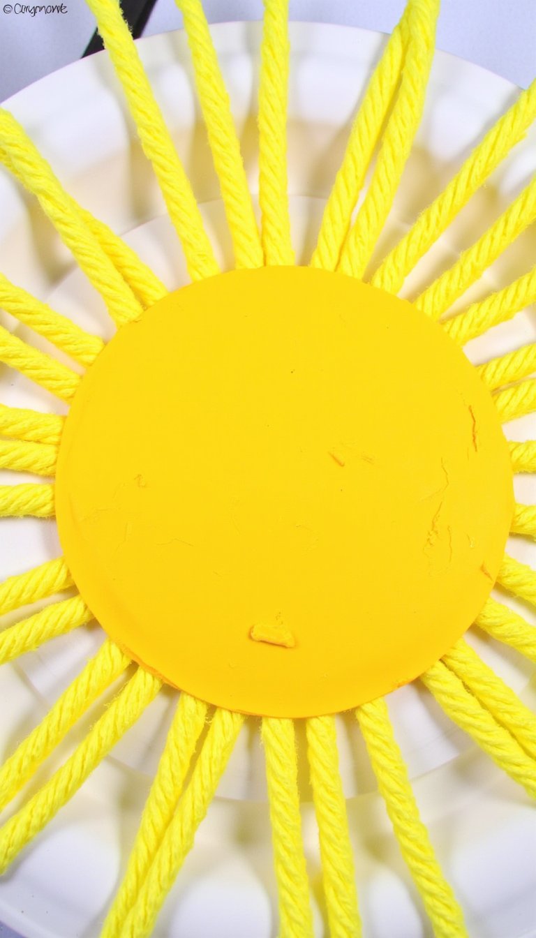 8. Paper Plate Sun Weaving